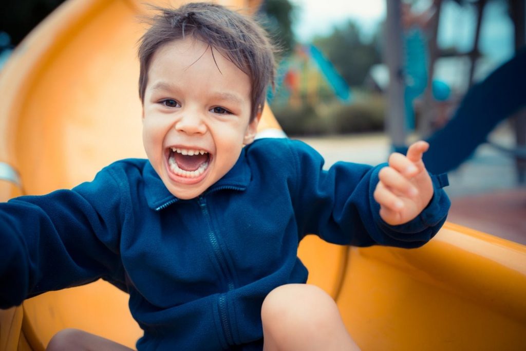 a young boy on a slide