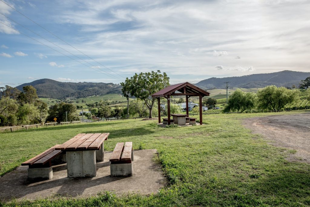 a open field with a picnic table