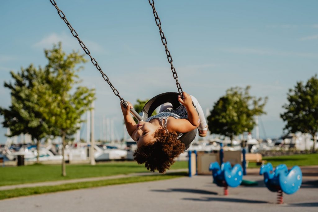 a child swinging on a swing