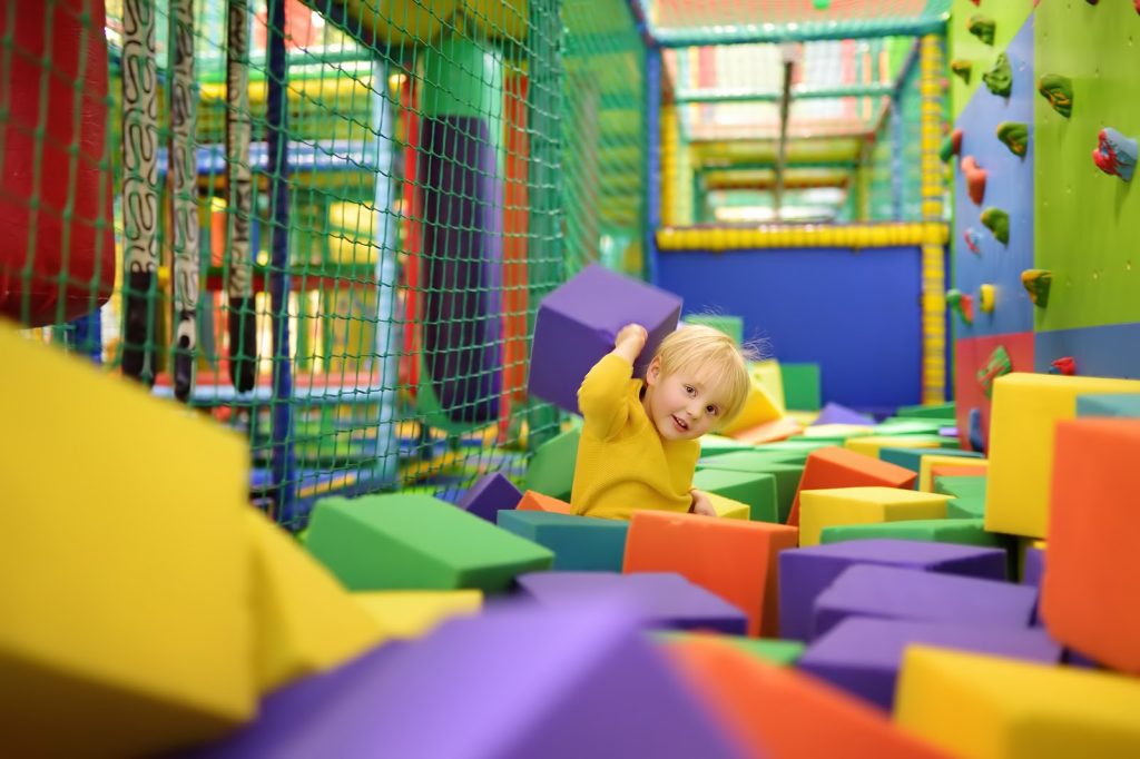 a child playing in a foam play area