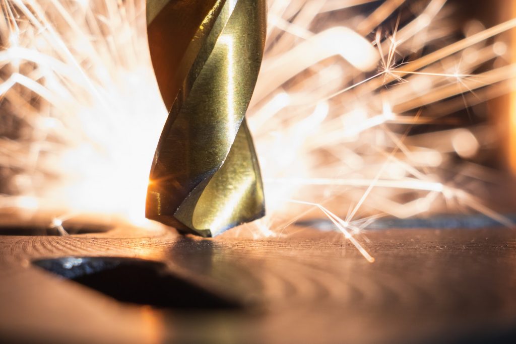 a molding being welded down with flames in the background