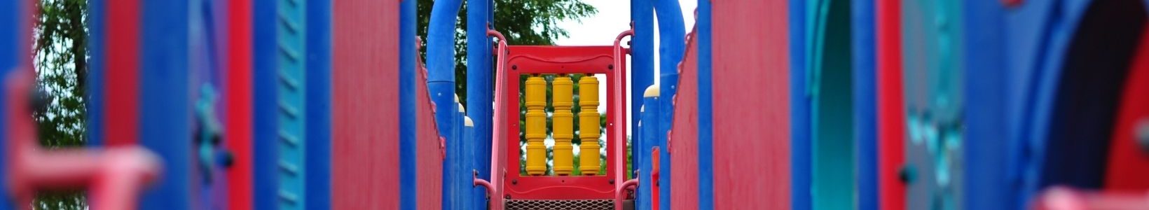A red and blue outdoor playground.