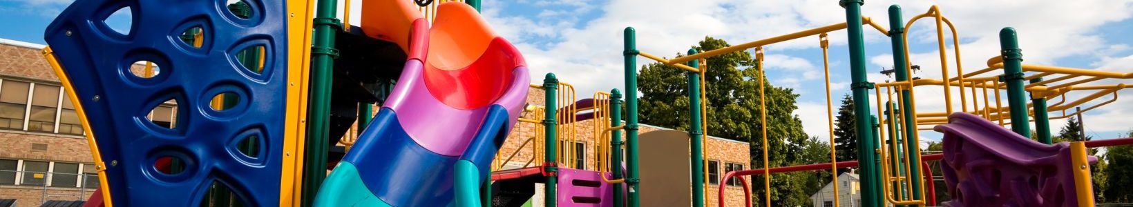 A plastic and metal outdoor playground.