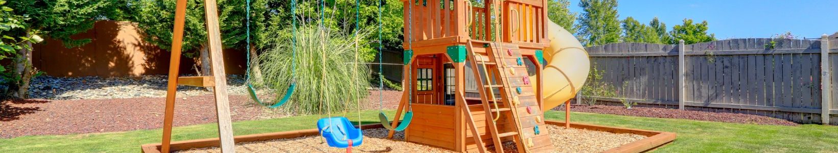 A outdoor playground in a backyard.