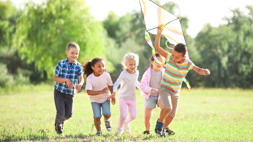 Children playing outside in the sun