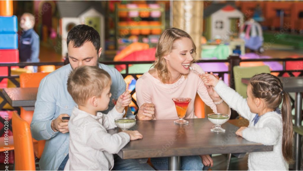 a family enjoying some sweet treats at a indoor playground business
