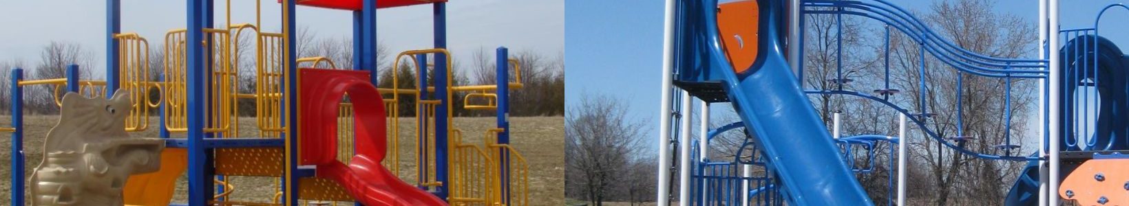 Two playground structures side by side. Left: Yellow and red with slides and a climbing wall. Right: Blue with slides and a rock climbing panel. Clear skies.