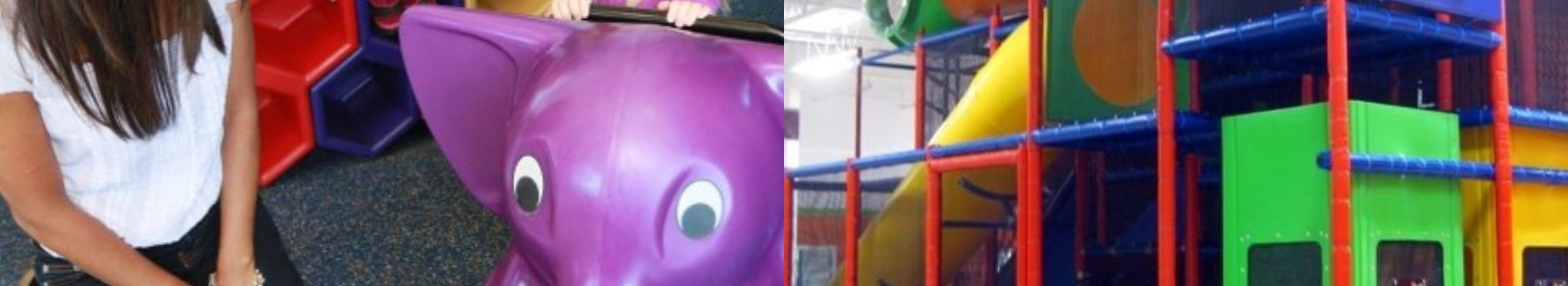 Child playing on indoor playground equipment with a caregiver and a colorful commercial indoor play structure.